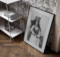 crowned queen seated portrait vintage art print poster in a black frame leaning beside a shelf in a raw-plaster loft