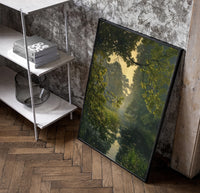 forest pond framed by overhanging branches vintage art print poster in a black frame leaning beside a shelf in a…