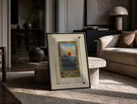 Splendor Solis The Sun print on the floor, leaning against a travertine table