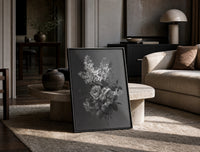white lilac and roses bouquet vintage art print print in a black frame leaning on a travertine table in a sunlit lounge