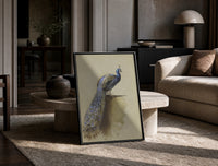 peacock with full tail perched on ledge vintage art print print in a black frame leaning on a travertine table in a…