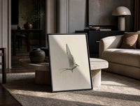tern in flight sketch vintage art print print in a black frame leaning on a travertine table in a sunlit lounge
