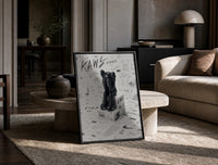 KAWS Companion Nike Swoosh Sketch framed poster print in a black frame leaning on a travertine table in a sunlit lounge
