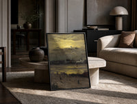 beach at sunset with silhouetted figures vintage art print print in a black frame leaning on a travertine table in a…