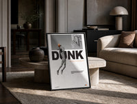 Basketball Dunk Motivation print on the floor, leaning against a travertine table