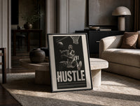 Dennis Rodman Hustle Basketball print on the floor, leaning against a travertine table
