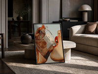 Luxury Fragrance Portrait framed poster print in a black frame leaning on a travertine table in a sunlit lounge