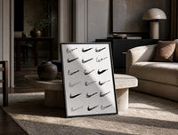 Nike Swoosh Hand-Drawn Sketch framed poster print in a black frame leaning on a travertine table in a sunlit lounge