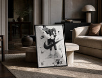 KAWS Companion Air Jordan Sneakers framed poster print in a black frame leaning on a travertine table in a sunlit lounge