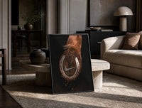 Nike Horse Hoof Swoosh Equestrian print on the floor, leaning against a travertine table
