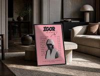 Pink Tyler, the Creator IGOR Tracklist print on the floor, leaning against a travertine table