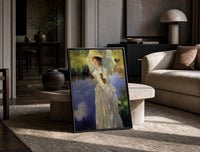 woman with a parasol beside a lily pond vintage art print print in a black frame leaning on a travertine table in a…