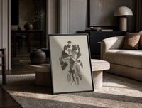 engraved currant branch study vintage art print print in a black frame leaning on a travertine table in a sunlit lounge