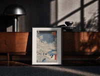 Black-framed Hiroshige Meguro Bridge in Snow print on the floor in front of a dark wooden console