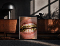 Black-framed AMG Grillz Gold Grill print on the floor in front of a dark wooden console