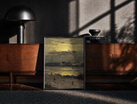 Black-framed beach at sunset with silhouetted figures vintage art print print on a moody console with designer…