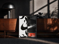 Black-framed Nike Swoosh Streetwear print on the floor in front of a dark wooden console