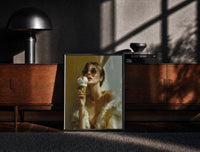 Black-framed Louis Vuitton Gold Ice Cream print on the floor in front of a dark wooden console