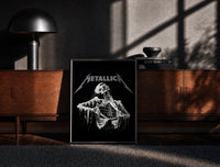 Black-framed Metallica Decaying Corpse Skeleton print on the floor in front of a dark wooden console