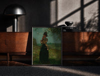 Black-framed woman under a blossoming tree vintage art print print on a moody console with designer coffee-table books