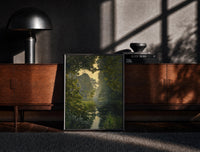Black-framed forest pond framed by overhanging branches vintage art print print on a moody console with designer…