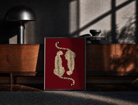 Black-framed Mirrored Cheetahs print on the floor in front of a dark wooden console