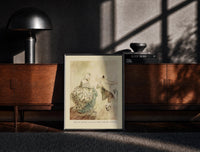 Black-framed Arthur Rackham Fezziwig's Dance print on the floor in front of a dark wooden console