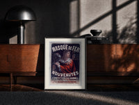 Black-framed Cheret Au Masque de Fer print on the floor in front of a dark wooden console