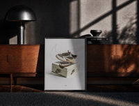 Black-framed Air Jordan 1 Travis Scott Reverse Mocha print on the floor in front of a dark wooden console