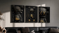 KAWS Black Label XX triptych in three black frames on a grey wall above a leather sofa