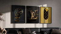 Louis Vuitton Pop Art triptych in three black frames on a grey wall above a leather sofa