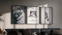 Nike AF1 White triptych in three black frames on a grey wall above a leather sofa