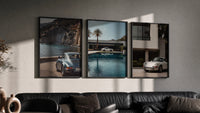 Porsche 911 Coastal framed poster set of 3 triptych in three black frames on a grey wall above a leather sofa