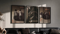 Nike Running Shoes triptych in three black frames on a grey wall above a leather sofa