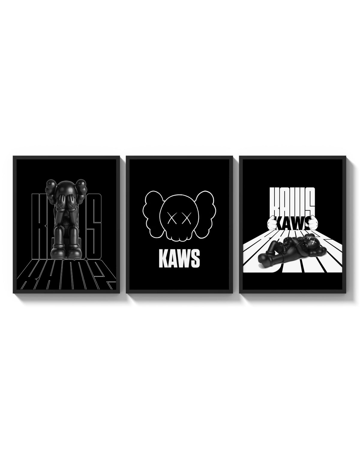 KAWS Monochrome Statement triptych arranged on a bright gallery wall