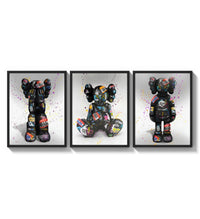 KAWS Companion Graffiti framed poster set of 3 three-panel set arranged as a triptych on a bright gallery wall