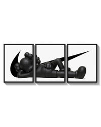 KAWS Companion triptych arranged on a bright gallery wall