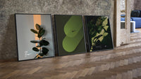 Nike Botanical framed poster set of 3 three-piece set leaning on parquet beside a vintage loft door