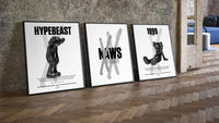 KAWS Black & White Classics three-piece set leaning on parquet beside a vintage loft door