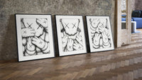 KAWS XX Crosshatch three-piece set leaning on parquet beside a vintage loft door