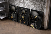 KAWS Black Label XX set of three black-framed prints leaning against a raw-plaster wall