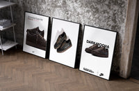 Air Jordan 1 Low Travis Scott set of three black-framed prints leaning against a raw-plaster wall