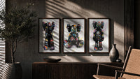 KAWS Companion Graffiti framed poster set of 3 triptych in three walnut frames above a sideboard in a warm room