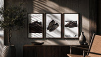 Air Jordan 1 Low Travis Scott triptych in three walnut frames above a sideboard in a warm room