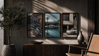 Porsche 911 Coastal framed poster set of 3 triptych in three walnut frames above a sideboard in a warm room