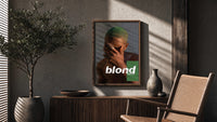 Blond Frank Ocean Album Cover Portrait poster framed above a fluted sideboard beside a potted tree