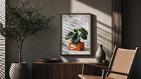 Nike Monstera Sneaker Box Green framed poster poster framed above a fluted sideboard beside an olive tree