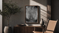 Chanel CC Necklace Black & White framed poster poster framed above a fluted sideboard beside an olive tree