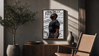 Kendrick Lamar Everything Profile poster framed above a fluted sideboard beside a potted tree