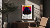 The Weeknd Starboy Album Cover poster framed above a fluted sideboard beside a potted tree